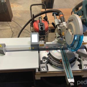 Pedante digital length stop integrated into miter saw setup for wood terrace production in France
