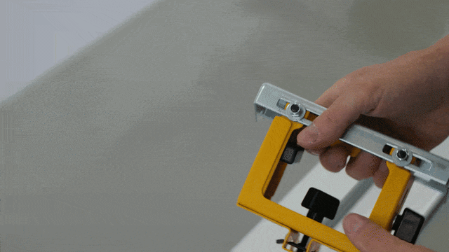 DeWALT DE7024 work support bracket attached to a portable miter saw stand for mounting a Pedante Digital Miter Saw Fence.