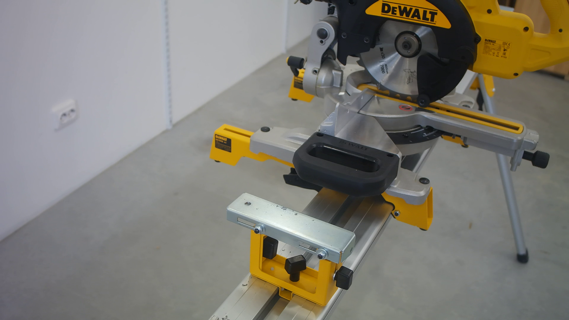 DeWALT work support with a hole drilled for mounting a Pedante Digital Miter Saw Fence.