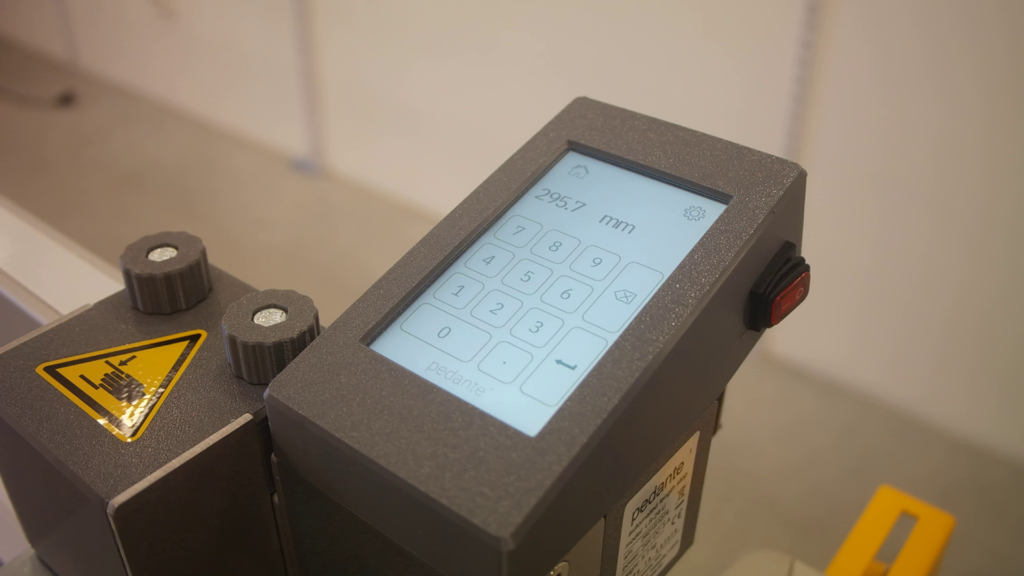 Pedante Digital Length Stop's control unit turned on with the screen displaying a numeric keypad.