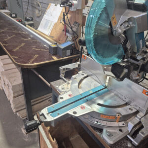 Pedante digital miter saw fence supporting accurate wood processing at Zunda Wood workshop in Latvia