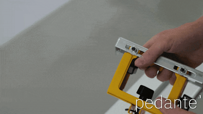 Sliding the extra work support into the DeWALT stand groove for the Pedante digital miter saw fence