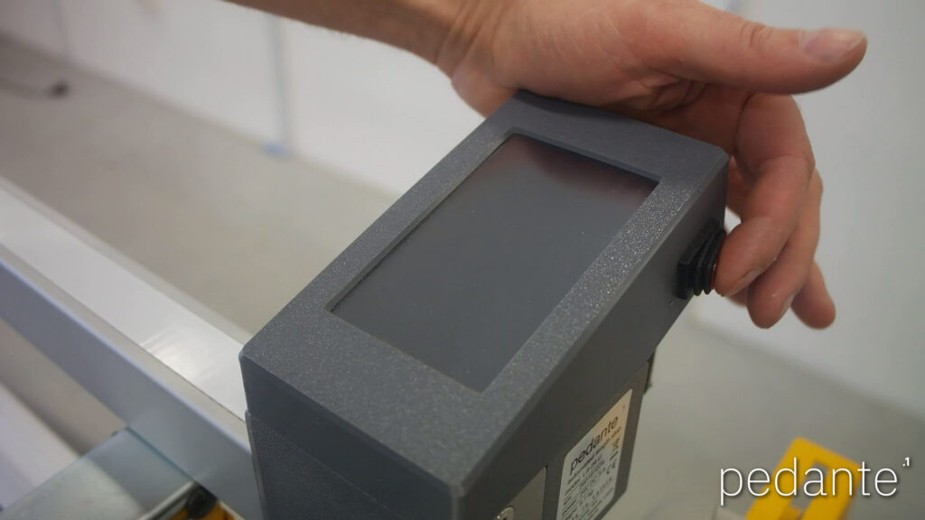 Switching on the control unit of the Pedante digital miter saw measuring system