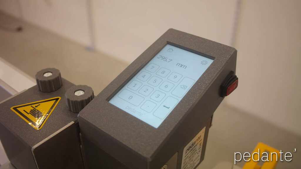 Powered-on Pedante touchscreen for setting the digital miter saw stop’s cutting length