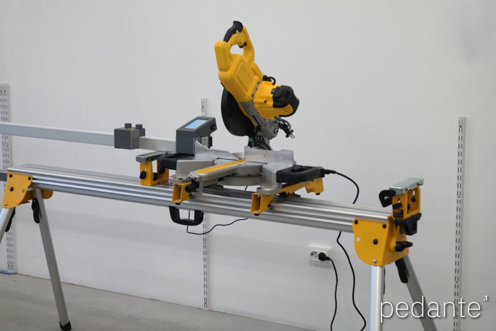 Completed Pedante digital miter saw fence installation on a DeWALT portable miter saw stand